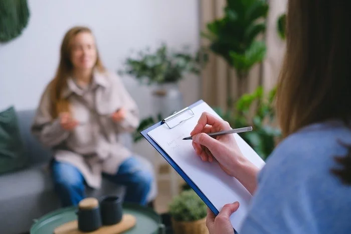 Medical professional taking notes about a patient's eating disorder